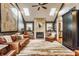 Bright living room with skylights, fireplace, bookshelves, and comfortable leather seating at 902 N College Ave, Indianapolis, IN 46202