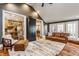 Cozy living room with hardwood floors, fireplace, access to kitchen and patio at 902 N College Ave, Indianapolis, IN 46202
