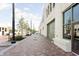 A beautiful street view of a walkable shopping district with brick sidewalks and landscaped areas at 902 N College Ave, Indianapolis, IN 46202
