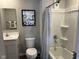 Clean bathroom with a shower-tub combo, white toilet, and modern fixtures at 990 Sunchaser Rd, Lebanon, IN 46052