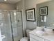 Clean, bright bathroom with a glass-enclosed shower and modern fixtures at 990 Sunchaser Rd, Lebanon, IN 46052