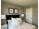 Comfortable bedroom with bedside tables and lamps flanking the bed; artwork decorates the wall at 990 Sunchaser Rd, Lebanon, IN 46052