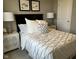 Inviting bedroom with a luxurious bed, elegant side tables, and stylish decor at 990 Sunchaser Rd, Lebanon, IN 46052