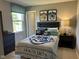 Charming bedroom with Hogwarts themed decor, a large window, and ample natural light at 990 Sunchaser Rd, Lebanon, IN 46052