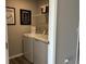 Functional laundry room with modern appliances and storage shelves for convenience at 990 Sunchaser Rd, Lebanon, IN 46052