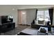 Comfortable living room with gray sofa, large window, and modern decor at 990 Sunchaser Rd, Lebanon, IN 46052