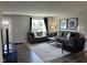 Spacious living room with neutral walls, stylish furnishings, and plenty of natural light at 990 Sunchaser Rd, Lebanon, IN 46052
