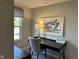 A cozy office with ample workspace, natural light, and serene decor at 990 Sunchaser Rd, Lebanon, IN 46052