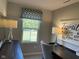 Bright office area with natural light, featuring a desk, window, and stylish lamps at 990 Sunchaser Rd, Lebanon, IN 46052