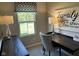Well-lit office with a patterned window valance, desk, and decorative wall art at 990 Sunchaser Rd, Lebanon, IN 46052