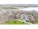 Aerial view showcasing condo's proximity to waterfront and bridge with ample parking at 107 Knoll Ct # F, Noblesville, IN 46062