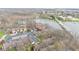Aerial view showcasing condo's proximity to waterfront and bridge with ample parking at 107 Knoll Ct # F, Noblesville, IN 46062