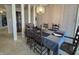 Formal dining room featuring a large table, chair set, and decorative wallpaper at 107 Knoll Ct # F, Noblesville, IN 46062