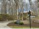Community entrance with signage, landscaping and road signs at 107 Knoll Ct # F, Noblesville, IN 46062