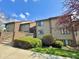 Inviting condo exterior with brick accents and manicured landscaping, creating a welcoming first impression at 107 Knoll Ct # F, Noblesville, IN 46062