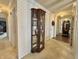 Hallway featuring carpeted floor and glass display case at 107 Knoll Ct # F, Noblesville, IN 46062