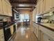 Bright kitchen featuring wood ceiling beams, tile floor, and breakfast nook area at 107 Knoll Ct # F, Noblesville, IN 46062