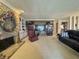 Bright living room with a stone fireplace, built-in bookcases, and comfortable seating, ideal for entertaining guests at 107 Knoll Ct # F, Noblesville, IN 46062