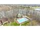 Aerial of condo community clubhouse featuring a spacious pool and water view at 107 Knoll Ct # F, Noblesville, IN 46062