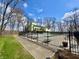 Community pool bordered by green space and trees at 107 Knoll Ct # F, Noblesville, IN 46062