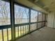 Screened porch offering views of the lake at 107 Knoll Ct # F, Noblesville, IN 46062