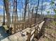 Outdoor stairway surrounded by trees offering access to lake and community amenities at 107 Knoll Ct # F, Noblesville, IN 46062