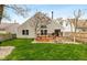 A backyard with a wood deck, a lawn, and a house with siding at 10820 Washington Bay Dr, Fishers, IN 46037