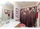 Charming bathroom featuring stylish floral shower curtain, vanity with sink, and tasteful decorations at 10820 Washington Bay Dr, Fishers, IN 46037