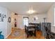 Inviting dining area with hardwood floors, modern lighting, and functional bar area for entertaining guests at 10820 Washington Bay Dr, Fishers, IN 46037