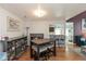 Open-concept dining area with hardwood floors, modern bar, and direct view to kitchen, ideal for entertaining at 10820 Washington Bay Dr, Fishers, IN 46037