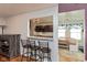 Open-concept kitchen offers bar seating, stone countertops, and seamlessly connects to the dining area at 10820 Washington Bay Dr, Fishers, IN 46037