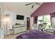 Elegant main bedroom with vaulted ceiling, plush carpet, and dresser, offering ample natural light at 10820 Washington Bay Dr, Fishers, IN 46037