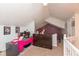 Lofted office with modern desk, carpeted floors, and bright, natural light, perfect for working from home at 10820 Washington Bay Dr, Fishers, IN 46037