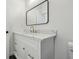 Close-up of bathroom vanity with white marble countertop and bronze fixtures at 1158 Burdsal Pkwy, Indianapolis, IN 46208