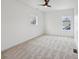 Bright bedroom has two windows, neutral carpet, and recessed lighting at 1158 Burdsal Pkwy, Indianapolis, IN 46208