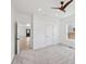 Bright bedroom boasts a ceiling fan, plush carpet, a window, and a closet door at 1158 Burdsal Pkwy, Indianapolis, IN 46208