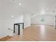 Large bonus room has recessed lights, wood floors, and white walls at 1158 Burdsal Pkwy, Indianapolis, IN 46208