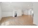 Bright bonus room offers recessed lights, wood floors, and white walls at 1158 Burdsal Pkwy, Indianapolis, IN 46208