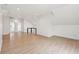 Large bonus room boasts recessed lights, wood floors, and a modern railing at 1158 Burdsal Pkwy, Indianapolis, IN 46208