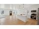 Modern kitchen with an island, stainless steel appliances, and an open view into the bright and spacious living area at 1158 Burdsal Pkwy, Indianapolis, IN 46208