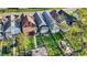 Aerial view of homes, showing roof lines, yard, trees and parked cars at 117 W Arizona St, Indianapolis, IN 46225