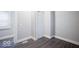 This cozy bedroom features modern flooring, fresh paint, and new trim, ready for comfortable living and personalization at 117 W Arizona St, Indianapolis, IN 46225
