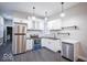The kitchen showcases granite countertops, complemented by stainless steel appliances, and efficient cabinet storage at 117 W Arizona St, Indianapolis, IN 46225