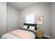The modern bedroom features an updated color scheme, modern window treatments, and contemporary decor at 117 W Arizona St, Indianapolis, IN 46225