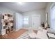 A versatile bedroom or office space with ample natural light, complemented by modern flooring and fresh paint at 117 W Arizona St, Indianapolis, IN 46225