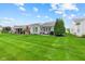 Expansive backyard features a well-manicured lawn with professional landscaping and mature trees for maximum privacy at 12821 Gloria Dr, Fishers, IN 46037