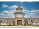 Clubhouse with stone and siding exterior detailing and mature landscaping at 12821 Gloria Dr, Fishers, IN 46037