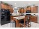 Kitchen featuring stainless steel appliances, granite countertops, and wooden cabinetry at 12821 Gloria Dr, Fishers, IN 46037