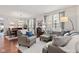 Bright and inviting living room with comfortable seating and a view into the dining area at 12821 Gloria Dr, Fishers, IN 46037