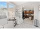 Bright sunroom connects to the kitchen and is illuminated by large windows and natural light at 12821 Gloria Dr, Fishers, IN 46037